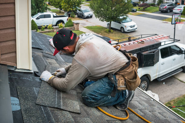 Professional Roofing technician working in Paoli, IN